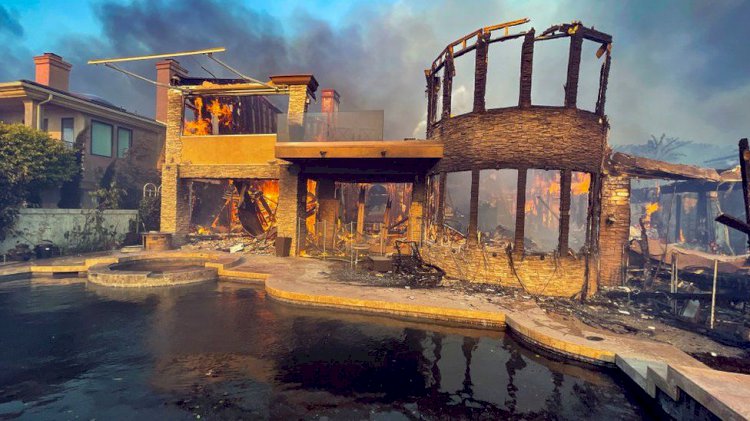 California mansions burn as wildfires spread